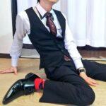 A man sprawled messily on the floor.